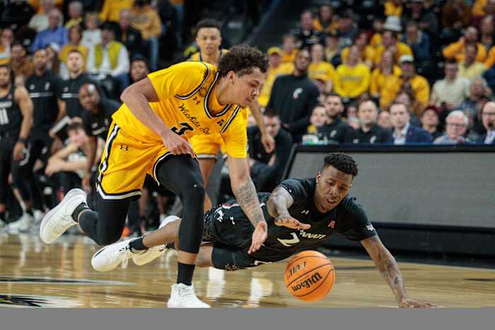 Jan 5, 2023; Wichita, Kansas, USA; Wichita State Shockers guard Craig Porter Jr. (3) and Cincinnati Bearcats guard Landers Nolley II (2) go after a loss ball during the second half at Charles Koch Arena. Mandatory Credit: William Purnell-USA TODAY Sports